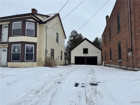 Attached, Backyard, Detached Garage, Exterior, Facade, Brick Facade, Rowhouse
