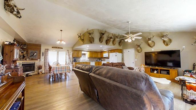 Chandelier, Dining room, Fireplace, Interior, Kitchen, Living room, Pendant Lights, Wood Texture Flooring