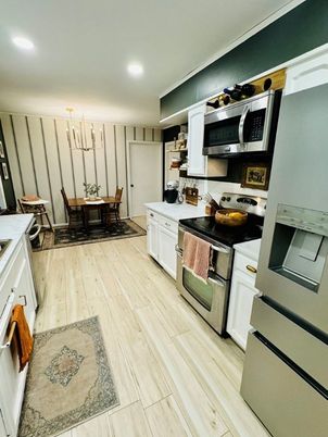 Dining room, Interior, Kitchen, Pendant Lights, Recessed Lighting, Stainless Steel Appliances, Wood Texture Flooring