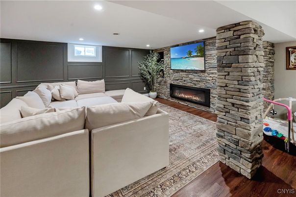 Fireplace, Interior, Living room, Recessed Lighting, Stone Walls, Wood Texture Flooring