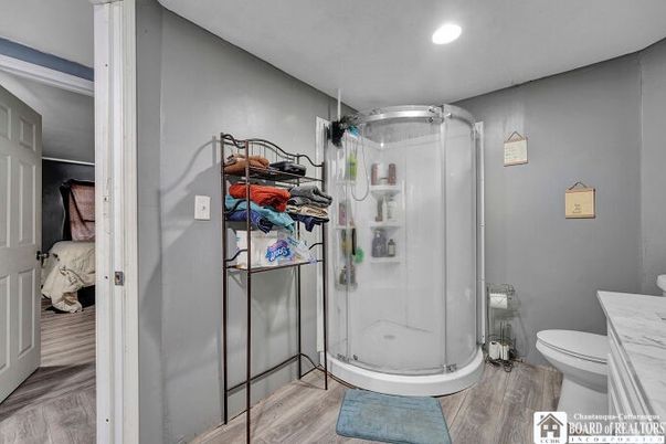 Bathroom, Glass Shower, Interior, Recessed Lighting, Wood Texture Flooring