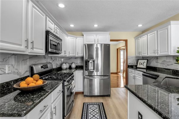 Interior, Kitchen, Marble Walls, Recessed Lighting, Stainless Steel Appliances, Wood Texture Flooring
