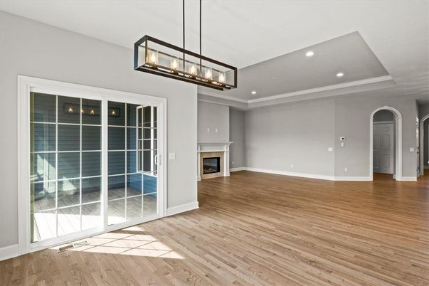 Empty room, Fireplace, Interior, Pendant Lights, Recessed Lighting, Wood Texture Flooring