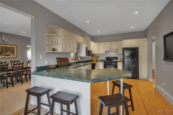 Dining room, Interior, Kitchen, Recessed Lighting, Stainless Steel Appliances, Wood Texture Flooring
