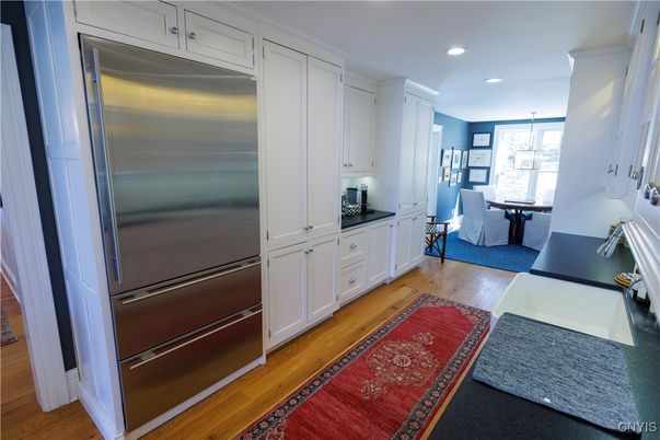Dining room, Interior, Kitchen, Pendant Lights, Recessed Lighting, Stainless Steel Appliances, Wood Texture Flooring