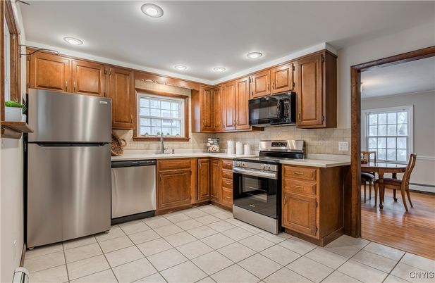 Dining room, Interior, Kitchen, Recessed Lighting, Stainless Steel Appliances, Wood Texture Flooring