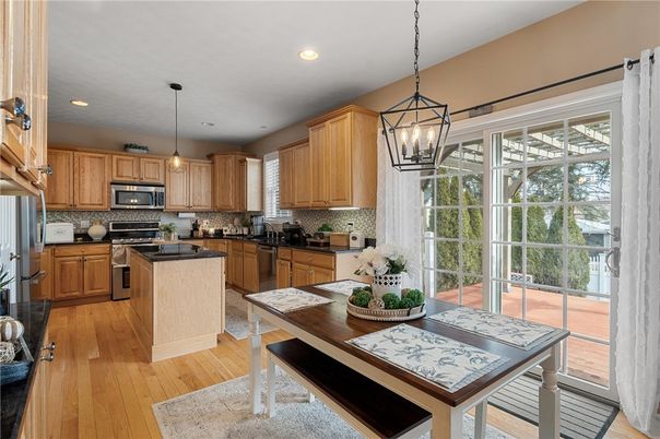 Dining room, Interior, Kitchen, Pendant Lights, Recessed Lighting, Stainless Steel Appliances, Wood Texture Flooring