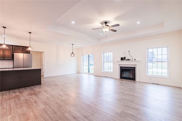 Empty room, Fireplace, Interior, Kitchen, Pendant Lights, Recessed Lighting, Wood Texture Flooring
