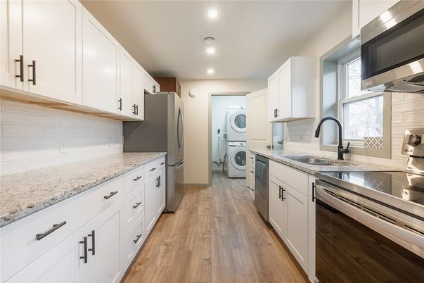 Interior, Kitchen, Recessed Lighting, Washer, Wood Texture Flooring