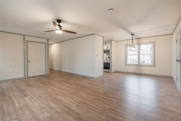 Empty room, Interior, Kitchen, Pendant Lights, Stainless Steel Appliances, Wood Texture Flooring