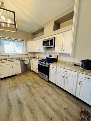 Interior, Kitchen, Pendant Lights, Stainless Steel Appliances, Wood Texture Flooring