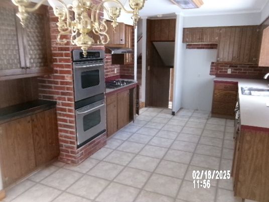 Chandelier, Interior, Kitchen, Stainless Steel Appliances, Stone Walls