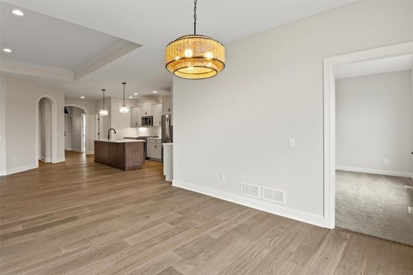Chandelier, Interior, Kitchen, Pendant Lights, Recessed Lighting, Stainless Steel Appliances, Wood Texture Flooring
