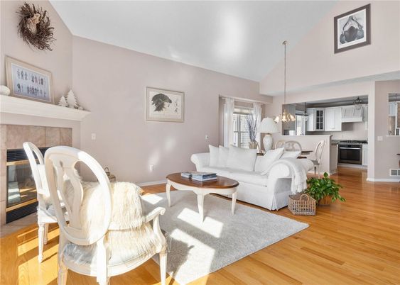 Fireplace, Interior, Kitchen, Living room, Pendant Lights, Stainless Steel Appliances, Wood Texture Flooring