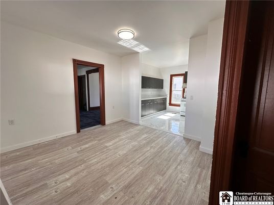 Empty room, Interior, Kitchen, Stainless Steel Appliances, Wood Texture Flooring