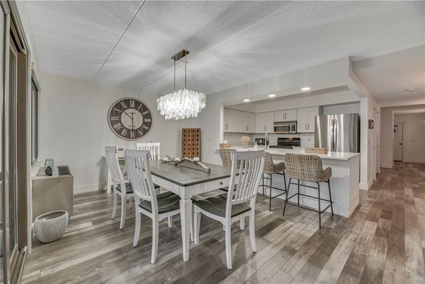Chandelier, Dining room, Interior, Kitchen, Recessed Lighting, Stainless Steel Appliances, Wood Texture Flooring