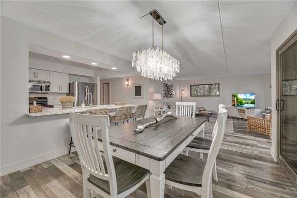 Chandelier, Dining room, Interior, Kitchen, Recessed Lighting, Stainless Steel Appliances, Wood Texture Flooring
