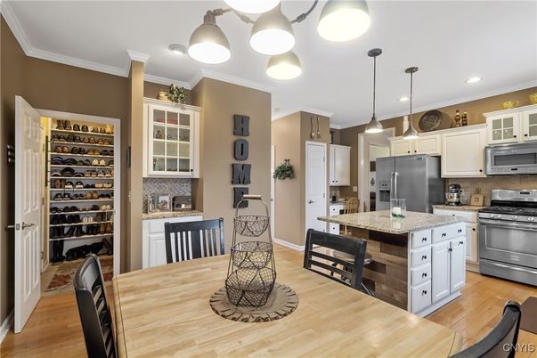 Dining room, Interior, Kitchen, Pendant Lights, Recessed Lighting, Stainless Steel Appliances, Wood Texture Flooring