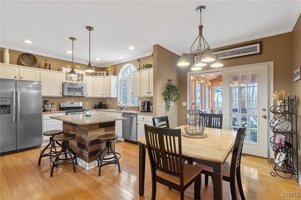 Dining room, Interior, Kitchen, Pendant Lights, Recessed Lighting, Stainless Steel Appliances, Wood Texture Flooring