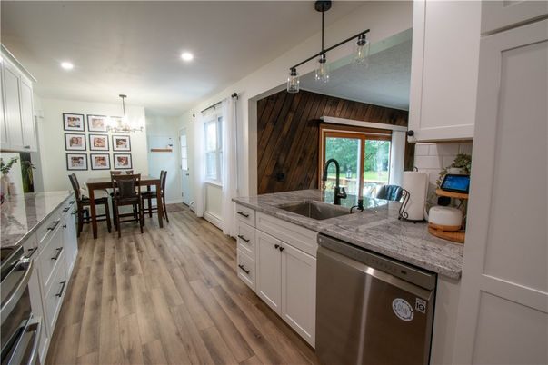 Chandelier, Dining room, Interior, Kitchen, Pendant Lights, Recessed Lighting, Stainless Steel Appliances, Wood Texture Flooring