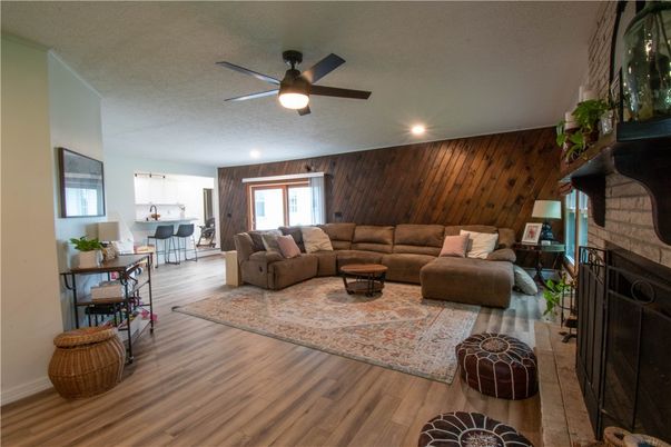 Dining room, Fireplace, Interior, Kitchen, Living room, Recessed Lighting, Wood Texture Flooring, Wooden Walls