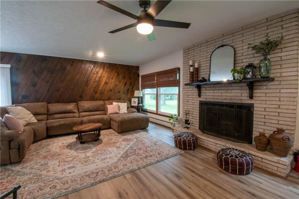 Fireplace, Interior, Living room, Recessed Lighting, Stone Walls, Wood Texture Flooring