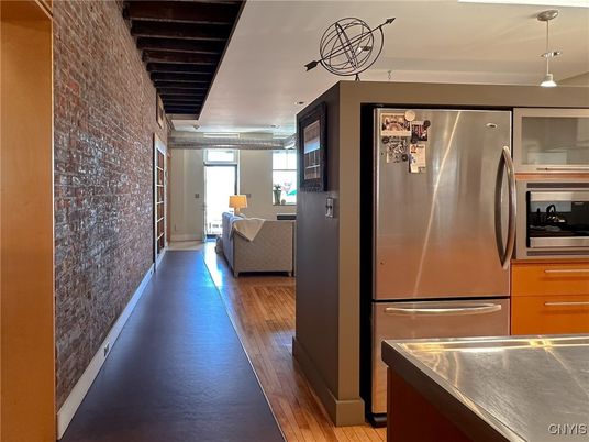 Interior, Kitchen, Living room, Pendant Lights, Stainless Steel Appliances, Stone Walls, Wood Texture Flooring
