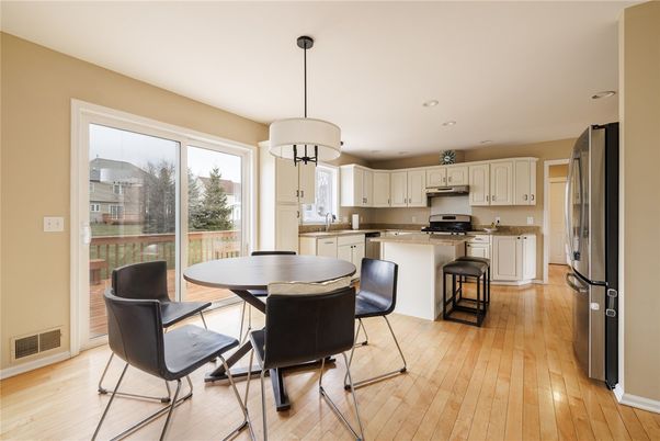 Dining room, Interior, Kitchen, Pendant Lights, Recessed Lighting, Stainless Steel Appliances, Wood Texture Flooring