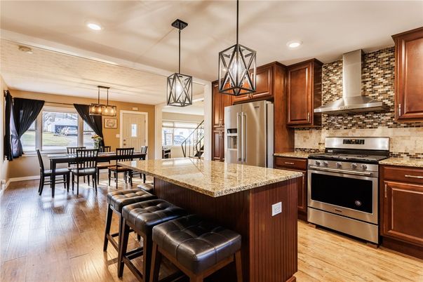 Dining room, Interior, Kitchen, Pendant Lights, Recessed Lighting, Stainless Steel Appliances, Wood Texture Flooring