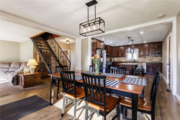 Dining room, Interior, Kitchen, Pendant Lights, Recessed Lighting, Stainless Steel Appliances, Wood Texture Flooring