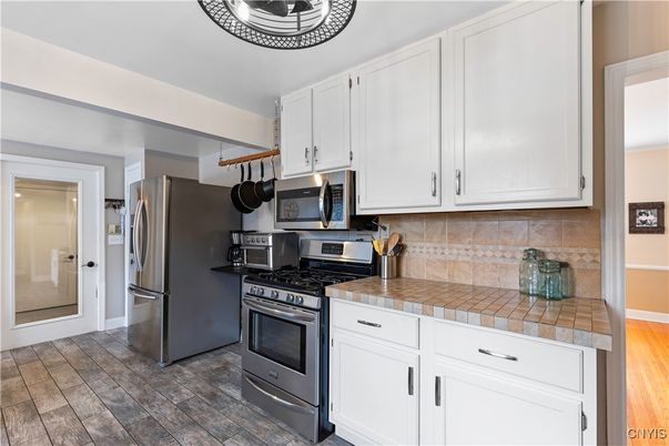 Interior, Kitchen, Stainless Steel Appliances, Tile Countertops, Wood Texture Flooring