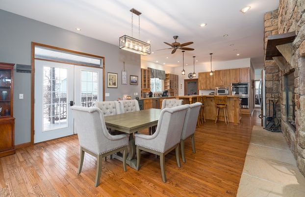 Dining room, Fireplace, Interior, Kitchen, Pendant Lights, Recessed Lighting, Stainless Steel Appliances, Stone Walls, Wood Texture Flooring