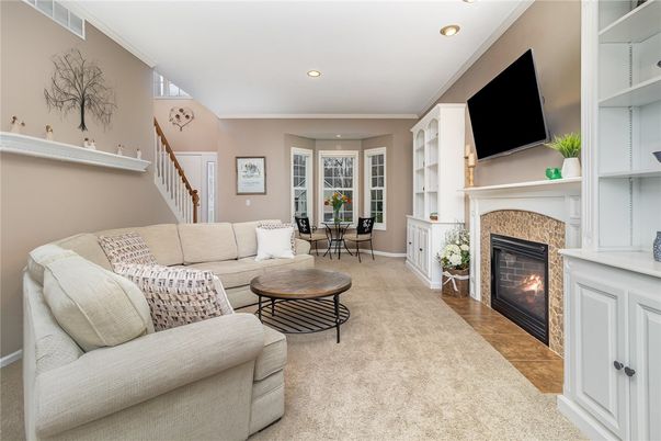 Dining room, Fireplace, Interior, Living room, Recessed Lighting, Wood Texture Flooring