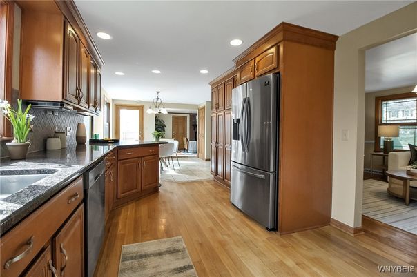 Chandelier, Dining room, Interior, Kitchen, Pendant Lights, Recessed Lighting, Stainless Steel Appliances, Wood Texture Flooring