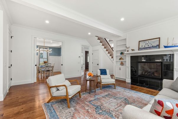 Dining room, Fireplace, Interior, Living room, Pendant Lights, Recessed Lighting, Wood Texture Flooring