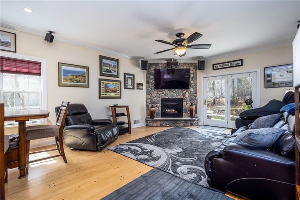 Dining room, Fireplace, Interior, Living room, Piano, Recessed Lighting, Wood Texture Flooring