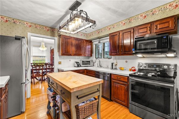 Chandelier, Dining room, Interior, Kitchen, Stainless Steel Appliances, Wood Texture Flooring