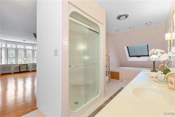 Bathroom, Dual Sink Vanities, Glass Shower, Interior, Recessed Lighting, Wood Texture Flooring
