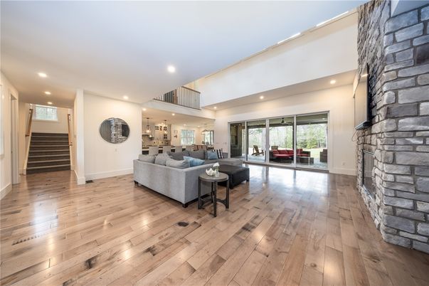 Fireplace, Interior, Living room, Recessed Lighting, Stone Walls, Wood Texture Flooring