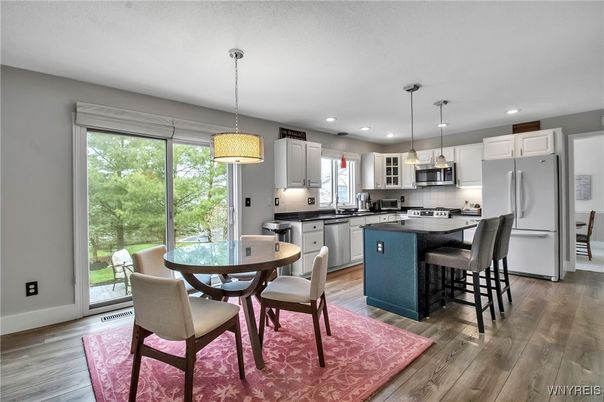 Dining room, Interior, Kitchen, Pendant Lights, Recessed Lighting, Stainless Steel Appliances, Wood Texture Flooring
