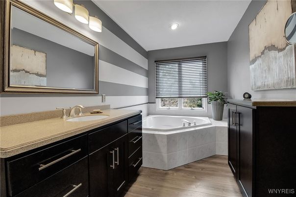 Bathroom, Dual Sink Vanities, Interior, Recessed Lighting, Wood Texture Flooring