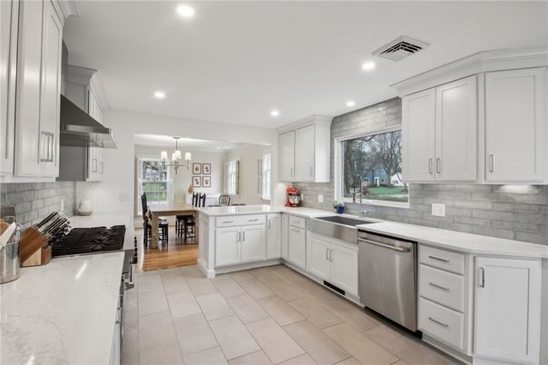 Chandelier, Dining room, Interior, Kitchen, Recessed Lighting, Stainless Steel Appliances, Wood Texture Flooring