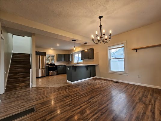 Chandelier, Interior, Kitchen, Pendant Lights, Recessed Lighting, Stainless Steel Appliances, Wood Texture Flooring