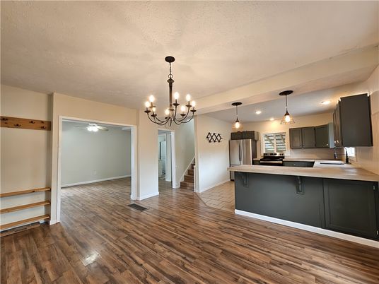 Chandelier, Interior, Kitchen, Pendant Lights, Stainless Steel Appliances, Wood Texture Flooring