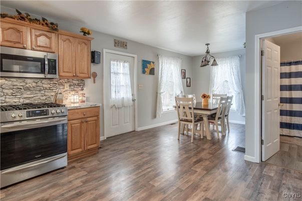 Dining room, Interior, Kitchen, Pendant Lights, Stainless Steel Appliances, Wood Texture Flooring