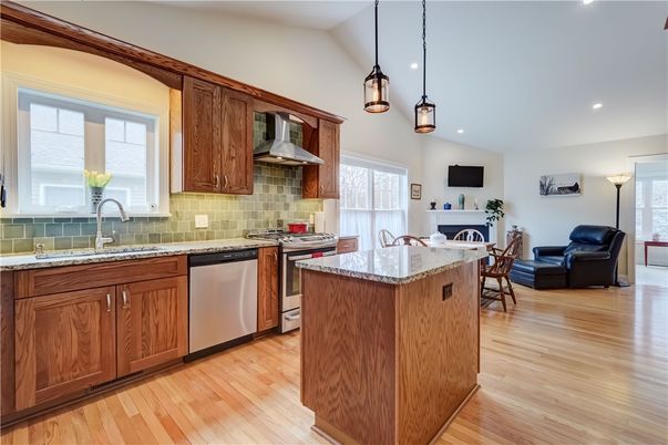Fireplace, Interior, Kitchen, Pendant Lights, Recessed Lighting, Stainless Steel Appliances, Wood Texture Flooring
