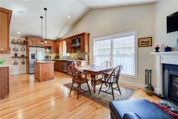 Dining room, Fireplace, Interior, Kitchen, Pendant Lights, Recessed Lighting, Stainless Steel Appliances, Wood Texture Flooring