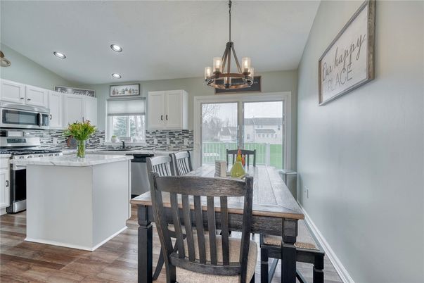 Dining room, Interior, Kitchen, Pendant Lights, Recessed Lighting, Stainless Steel Appliances, Wood Texture Flooring