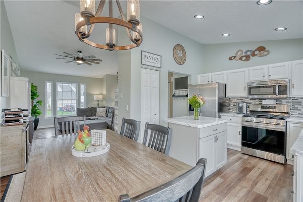 Chandelier, Dining room, Interior, Kitchen, Living room, Recessed Lighting, Stainless Steel Appliances, Wood Texture Flooring