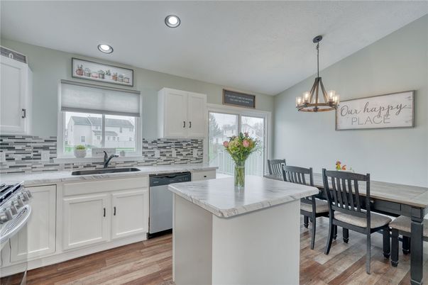 Dining room, Interior, Kitchen, Pendant Lights, Recessed Lighting, Stainless Steel Appliances, Wood Texture Flooring